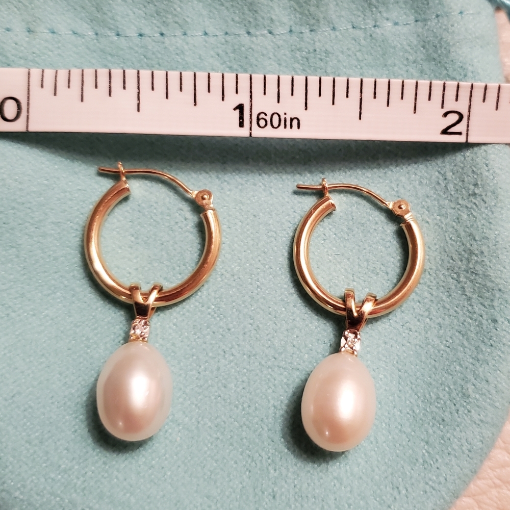 Solid 14k pearl and diamond hoop dangle earrings with removable charms.